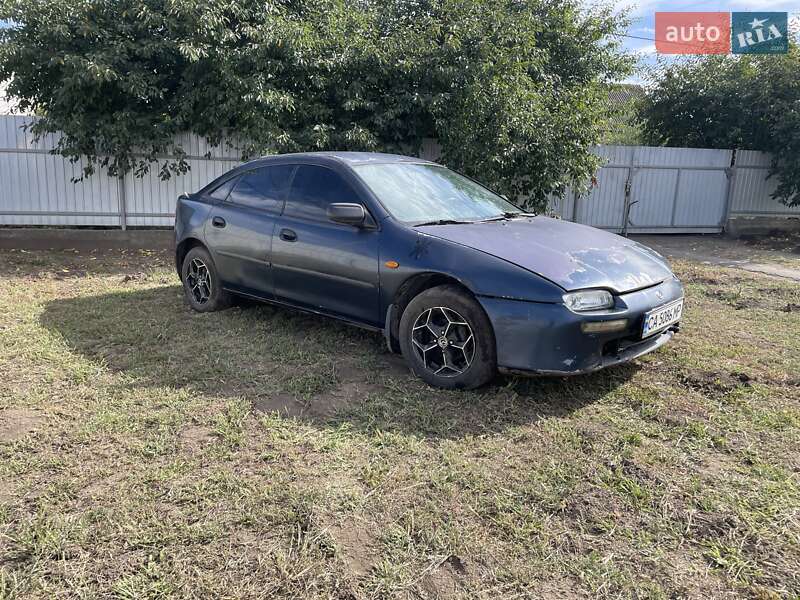 Хэтчбек Mazda 323 1997 в Корсуне-Шевченковском Хэтчбек Mazda 323 1997 в Корсуне-Шевченковском