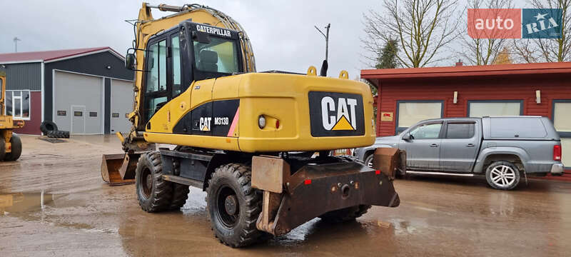 Колесный экскаватор Caterpillar 313 2010 в Одессе