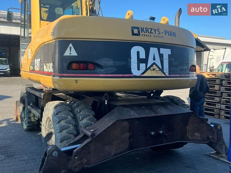 Колесный экскаватор Caterpillar 313 2003 в Косове