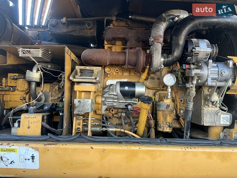 Колесный экскаватор Caterpillar 313 2003 в Косове