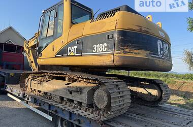 Екскаватор навантажувач Caterpillar 318 2005 в 