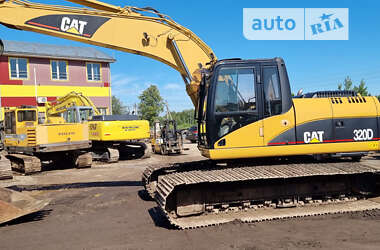 Гусеничный экскаватор Caterpillar 320 2009 в 