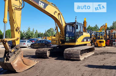 Гусеничный экскаватор Caterpillar 320 2009 в 