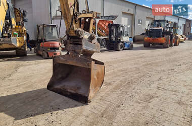 Гусеничный экскаватор Caterpillar 320 2013 в 
