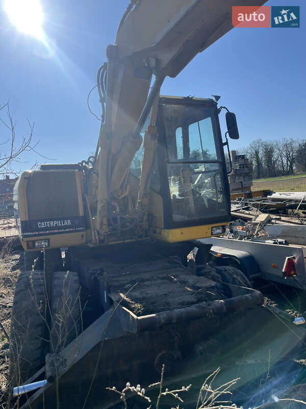 Колесный экскаватор Caterpillar M312 2001 в Косове