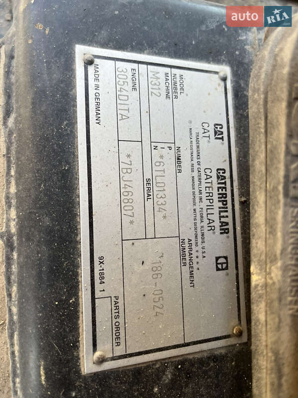 Колесный экскаватор Caterpillar M312 2001 в Косове