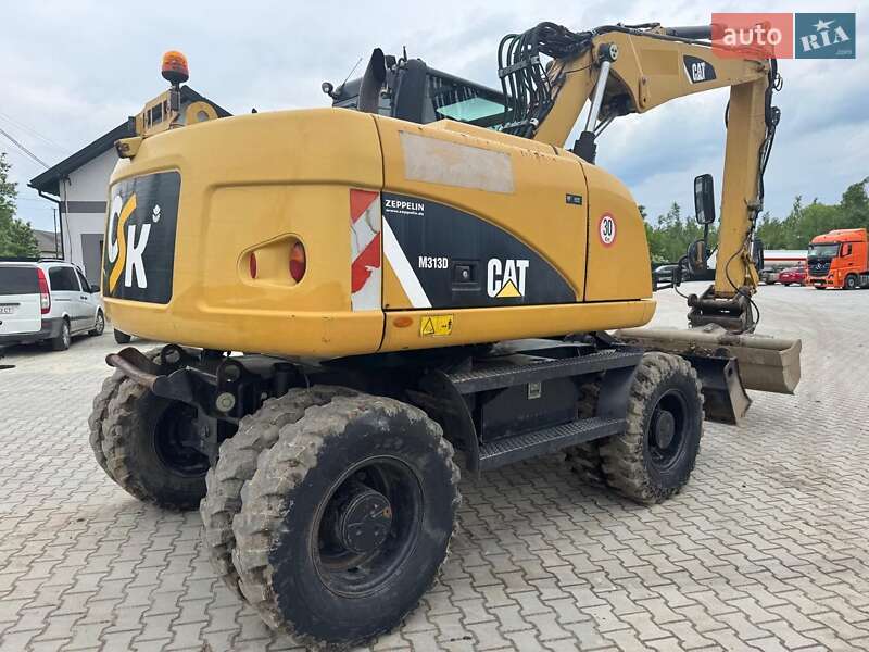 Колесный экскаватор Caterpillar M313 2012 в Долине