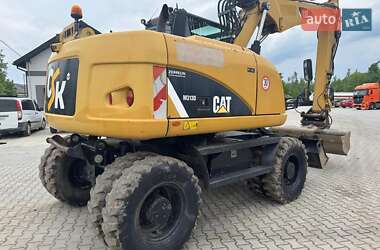 Колесный экскаватор Caterpillar M313 2012 в 