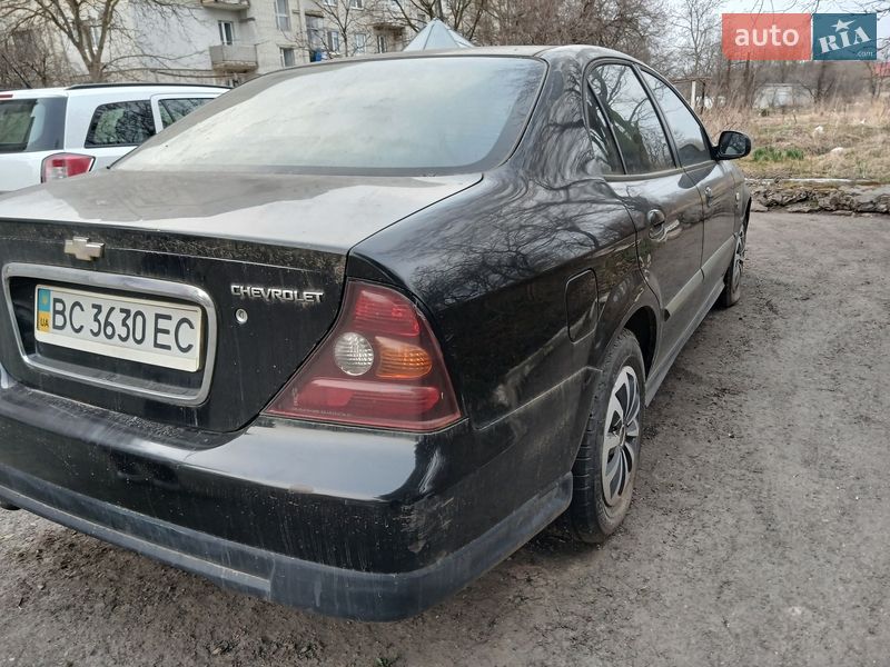 2006 Chevrolet Evanda, VIN KL1LF69ZE6B189998:plate — фото 1 (autoria)