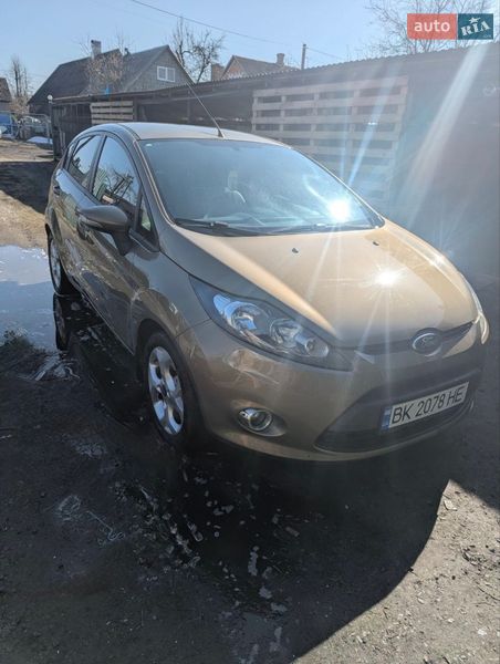 2011 Ford Fiesta, VIN WF0JXXGAJJBJ86010:plate — фото 1 (autoria)