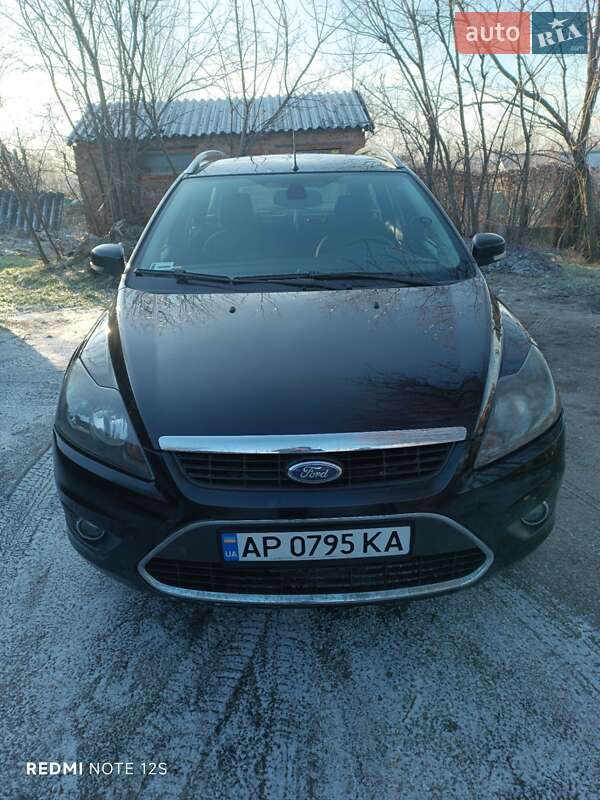 2009 Ford Focus, VIN WF0SXXGCDS9J39704:plate — фото 1 (autoria)