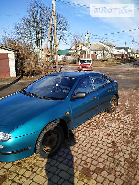 Хэтчбек Mazda 323 1998 в Глухове фото 2 Хэтчбек Mazda 323 1998 в Глухове