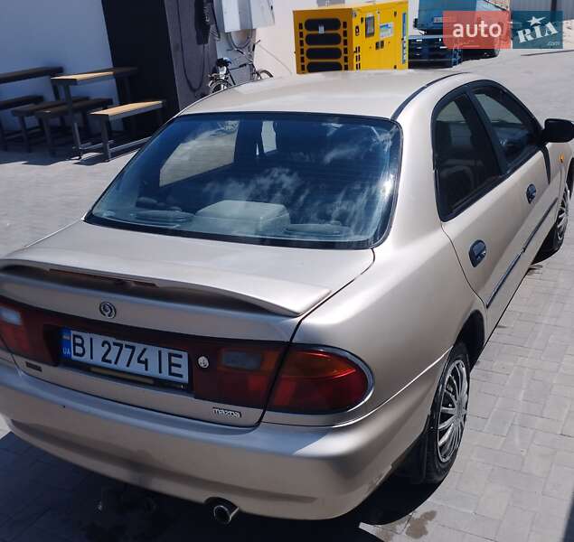 Седан Mazda 323 1995 в Кременчуці фото 2 Седан Mazda 323 1995 в Кременчуці