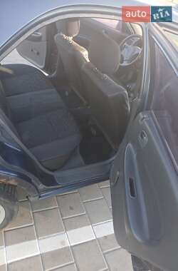 Седан Mazda 323 1998 в 