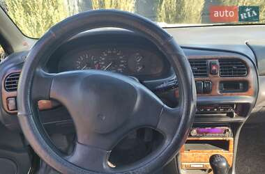 Хэтчбек Mazda 323 1996 в 