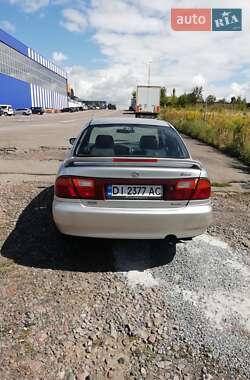Седан Mazda 323 1996 в  фото 11 Седан Mazda 323 1996 в