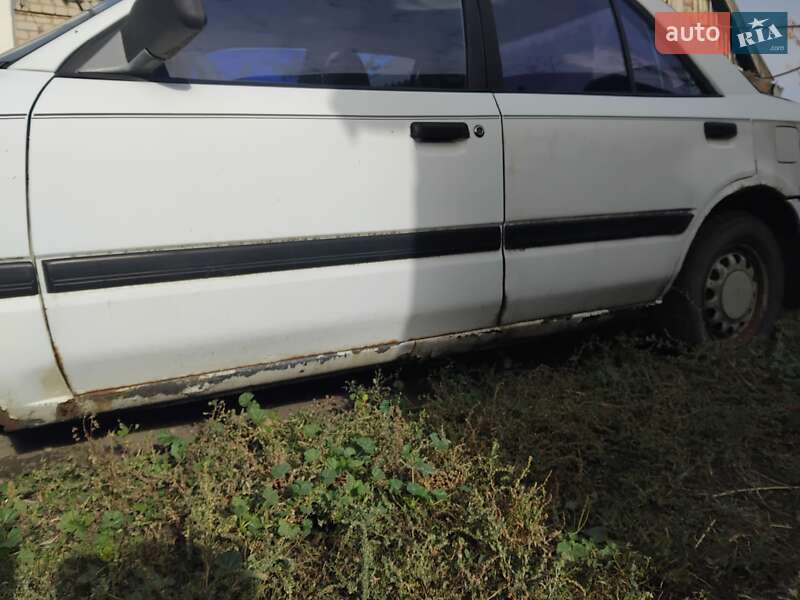 Седан Mazda 323 1991 в Солоному фото 2 Седан Mazda 323 1991 в Солоному