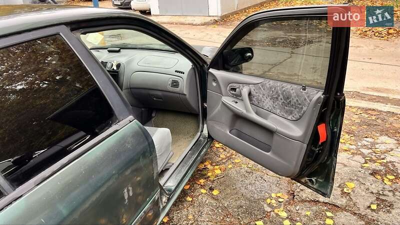 Хетчбек Mazda 323 1999 в Києві фото 8 Хетчбек Mazda 323 1999 в Києві
