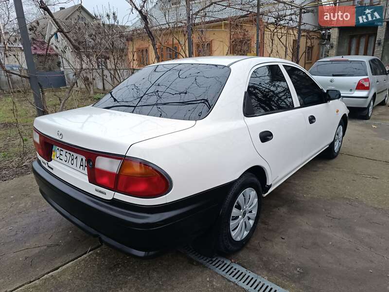 Седан Mazda 323 1998 в Чернівцях фото 29 Седан Mazda 323 1998 в Чернівцях