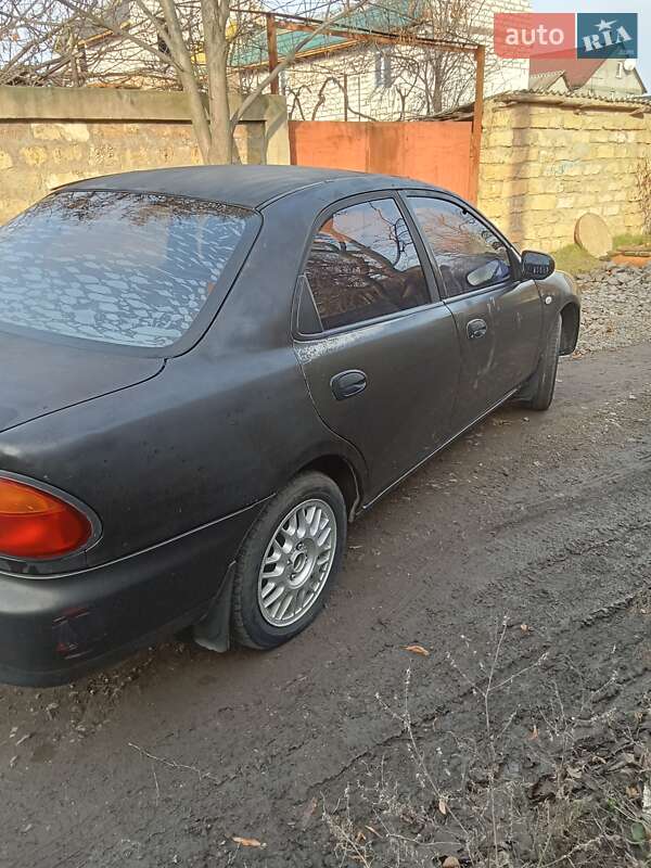 Седан Mazda 323 1995 в Одесі фото 10 Седан Mazda 323 1995 в Одесі