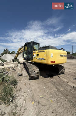 Екскаватор навантажувач New Holland E 305 2013 в 