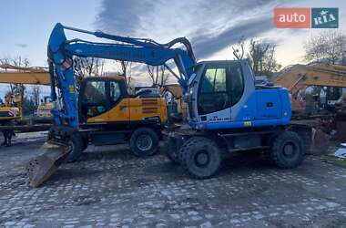 Колісний екскаватор New Holland MH 3.6 2011 в Коломиї