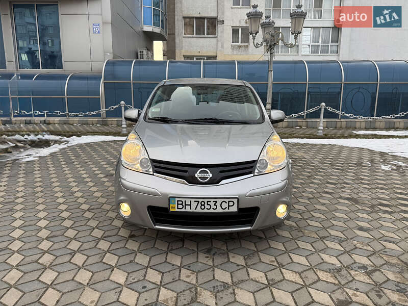 2010 Nissan Note, VIN SJNFCAE11U2074664:plate — фото 1 (autoria)