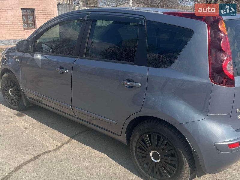 2009 Nissan Note, VIN SJNFAAE11U2019508:plate — фото 1 (autoria)
