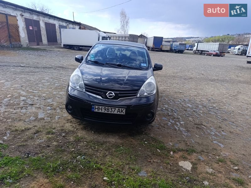 2009 Nissan Note, VIN SJNFAAE11U2022357:plate — фото 1 (autoria)