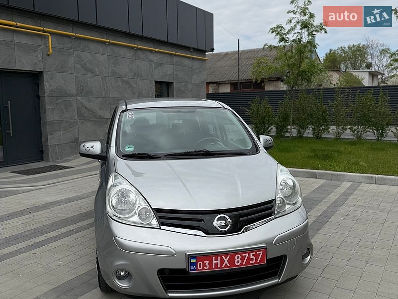 2010 Nissan Note, VIN SJNFAAE11U2055818:plate — фото 1 (autoria)