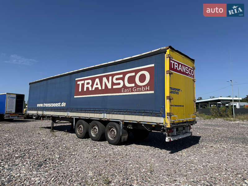 Бортовой полуприцеп Schmitz Cargobull S01 2002 в Киеве