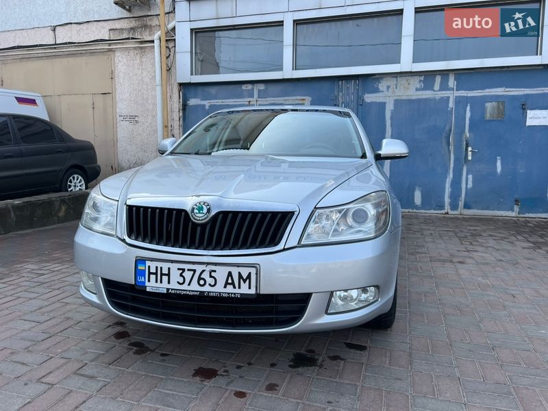 2011 Skoda Octavia, VIN TMBCA41Z8CB150610:plate — фото 1 (autoria)