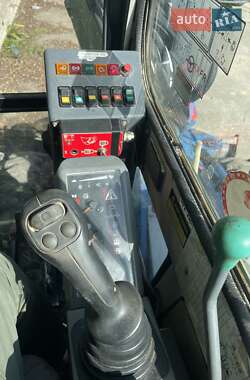 Колесный экскаватор Takeuchi TB 2007 в 