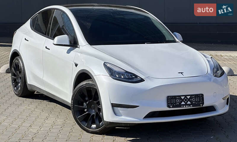 2023 Tesla Model Y, VIN LRWYGDEE3PC107284:plate — фото 1 (autoria)