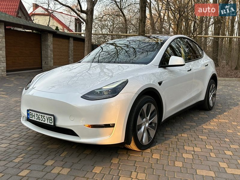 2022 Tesla Model Y, VIN 7SAYGDEE7PF628498:plate — фото 1 (autoria)