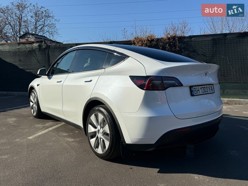 2022 Tesla Model Y, VIN 7SAYGDEEXPF610464:plate — фото 1 (autoria)