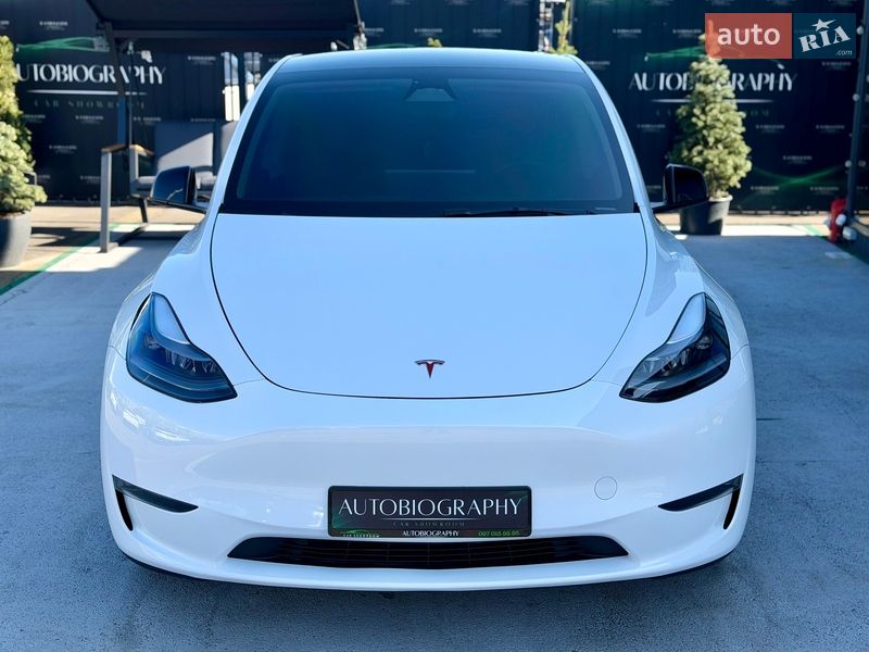 2023 Tesla Model Y, VIN 7SAYGAEE1PF906942:plate — фото 1 (autoria)